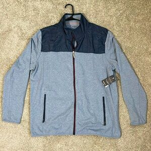 Flag&Anthem jacket. Two toned blue with a red zipper. Never been worn!